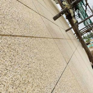 盘锦 黄金麻花岗岩荔枝面外墙干挂石材效果示例