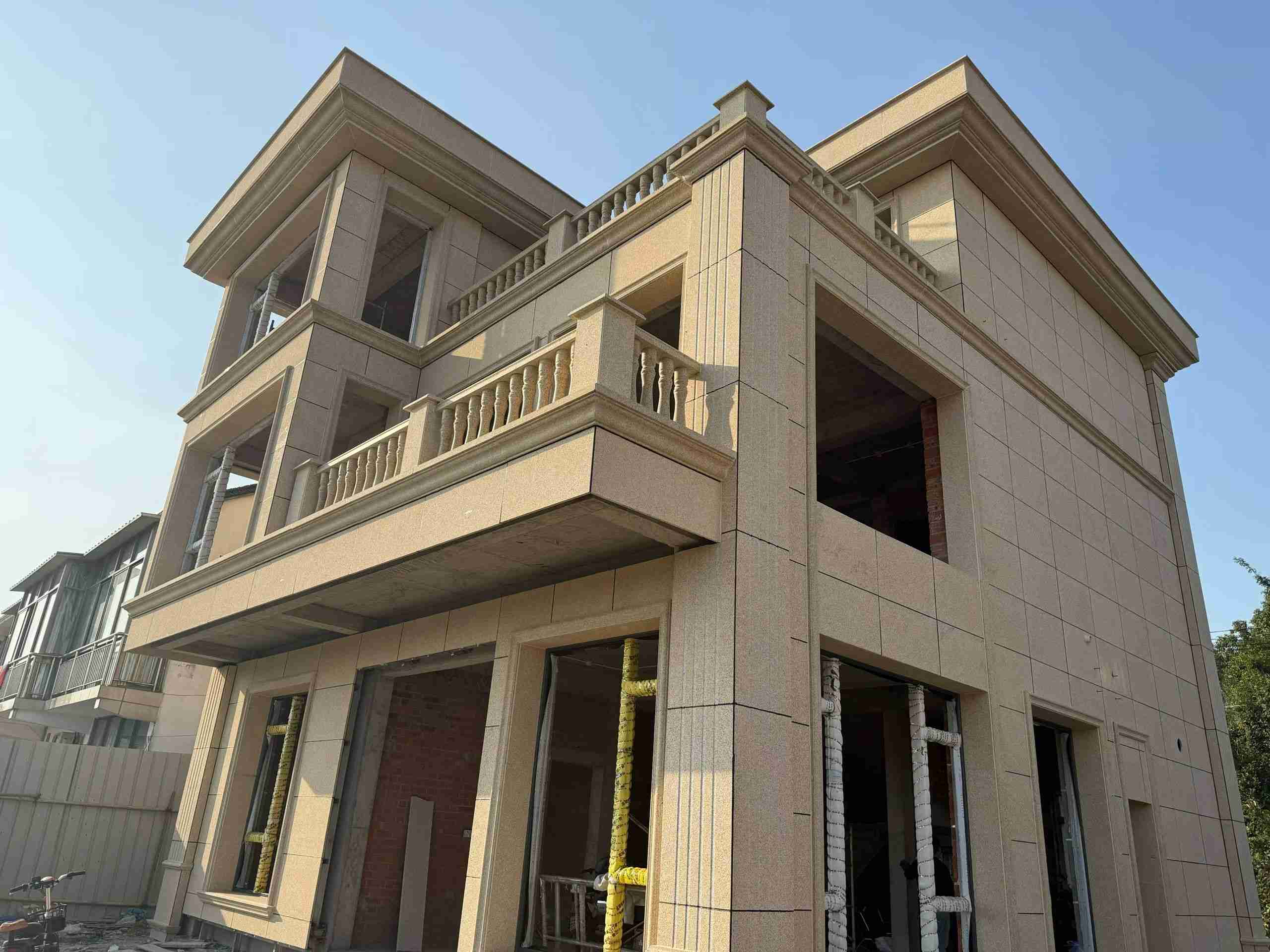 盘锦 黄金麻花岗岩石材荔枝面外墙干挂效果展示